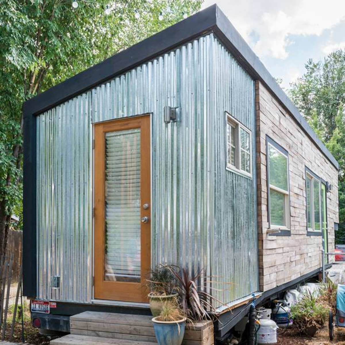 this tiny cabin made from an upcycled shipping container is self-sufficient