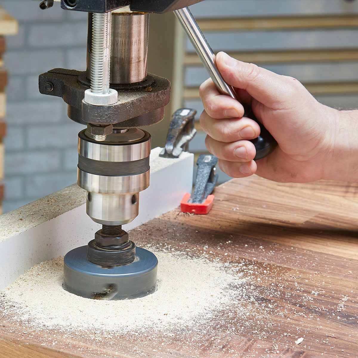 Drill press cutting into wood | Construction Pro Tips
