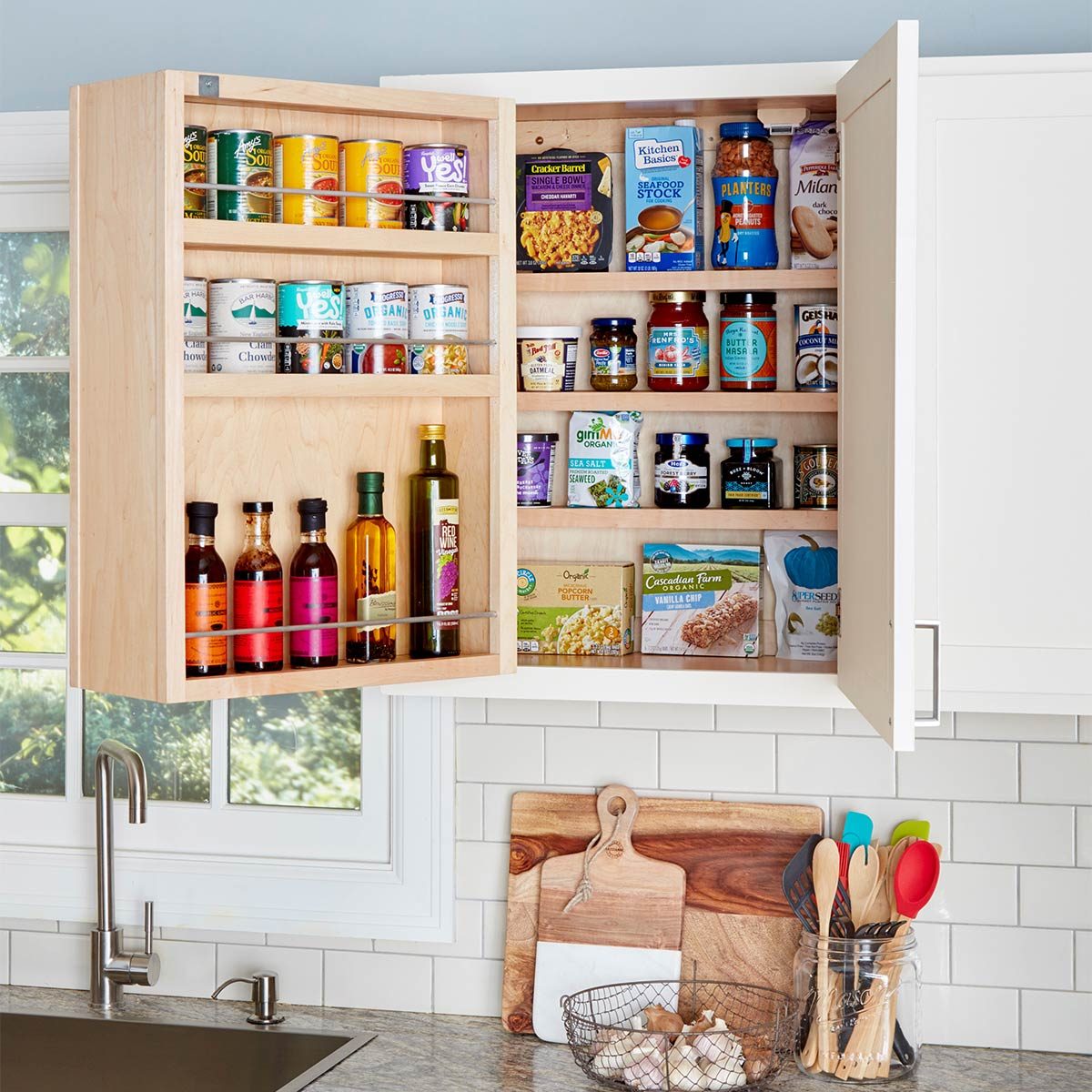 https://www.familyhandyman.com/wp-content/uploads/2019/01/swing-out-kitchen-cabinet.jpg?fit=696%2C696