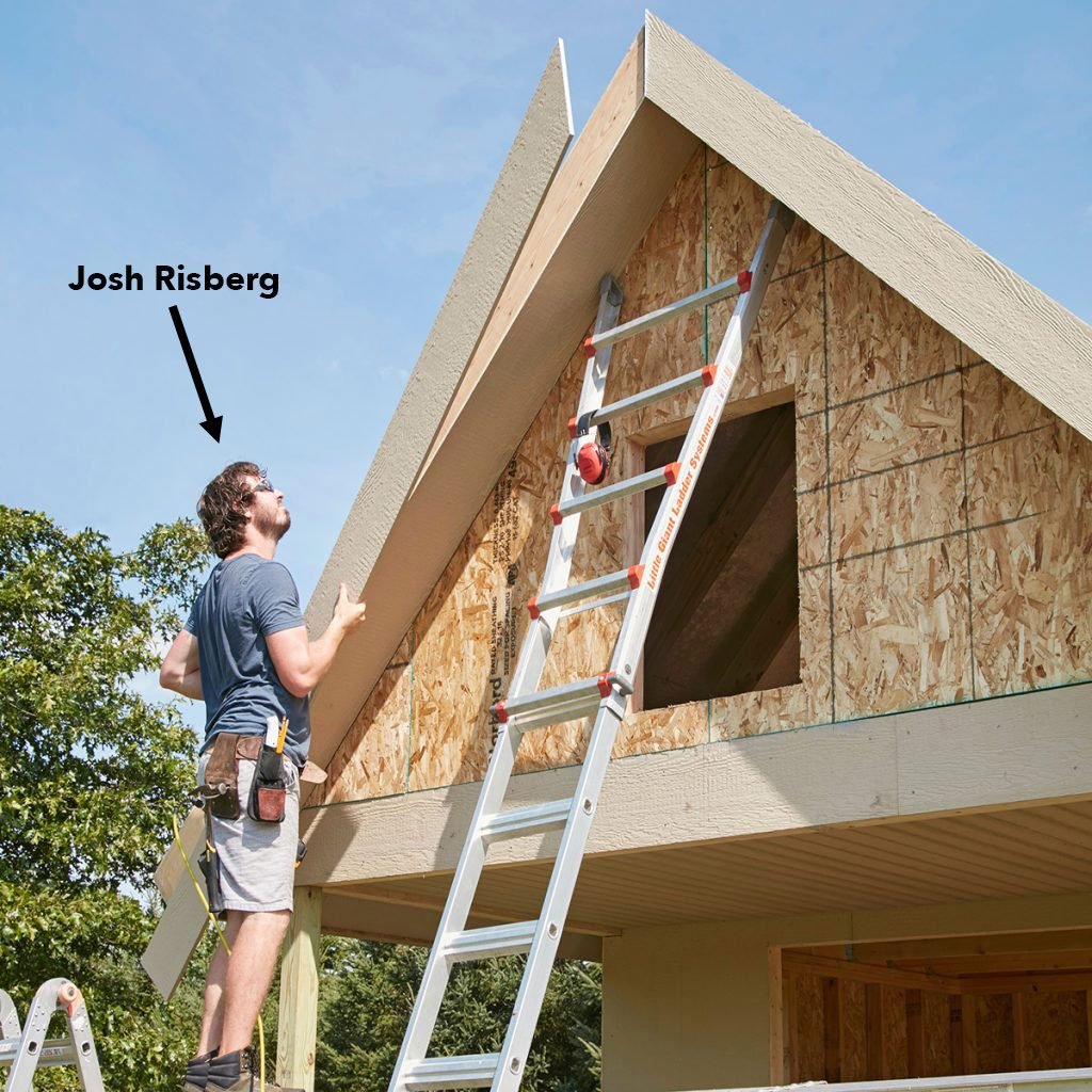 carpenter lining up a long piece of exterior trim