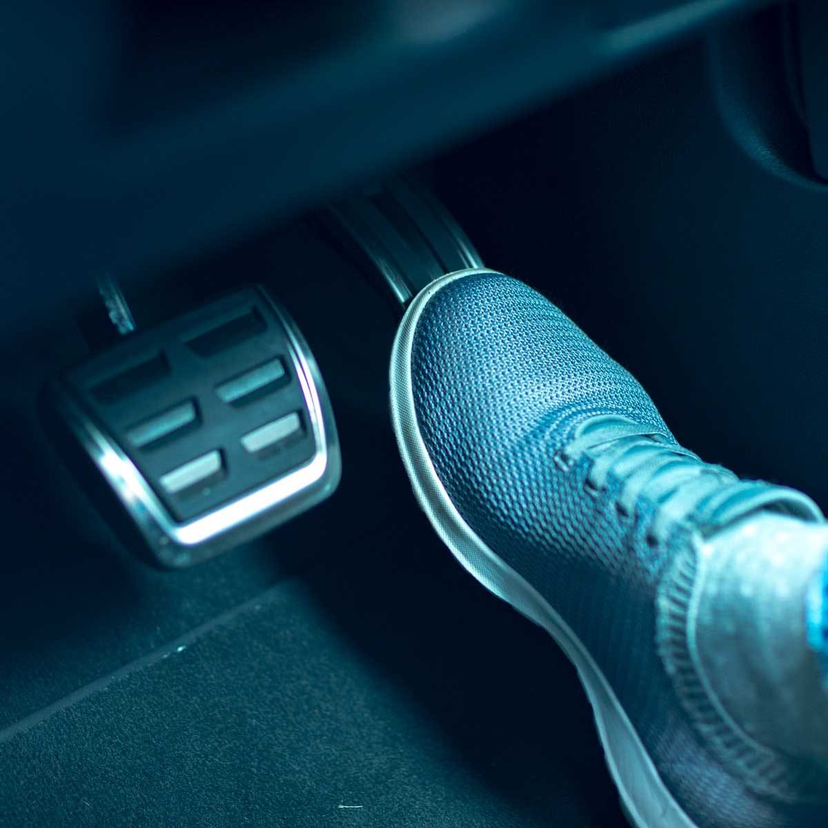 Sneaker by a Gas pedal