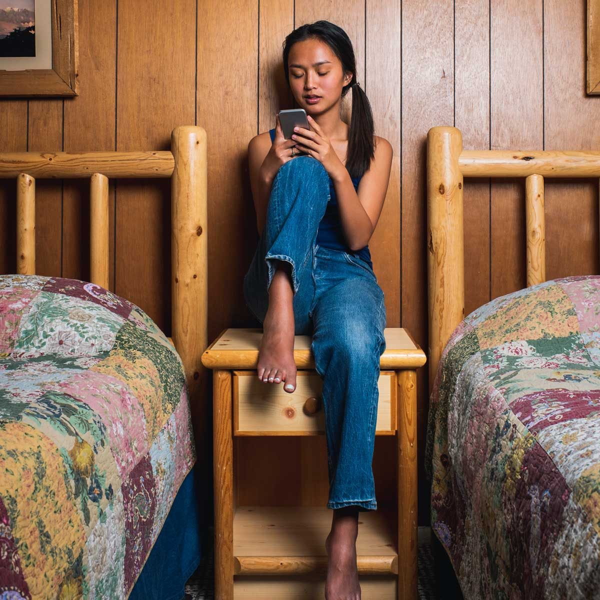 Woman sitting on Log Furniture