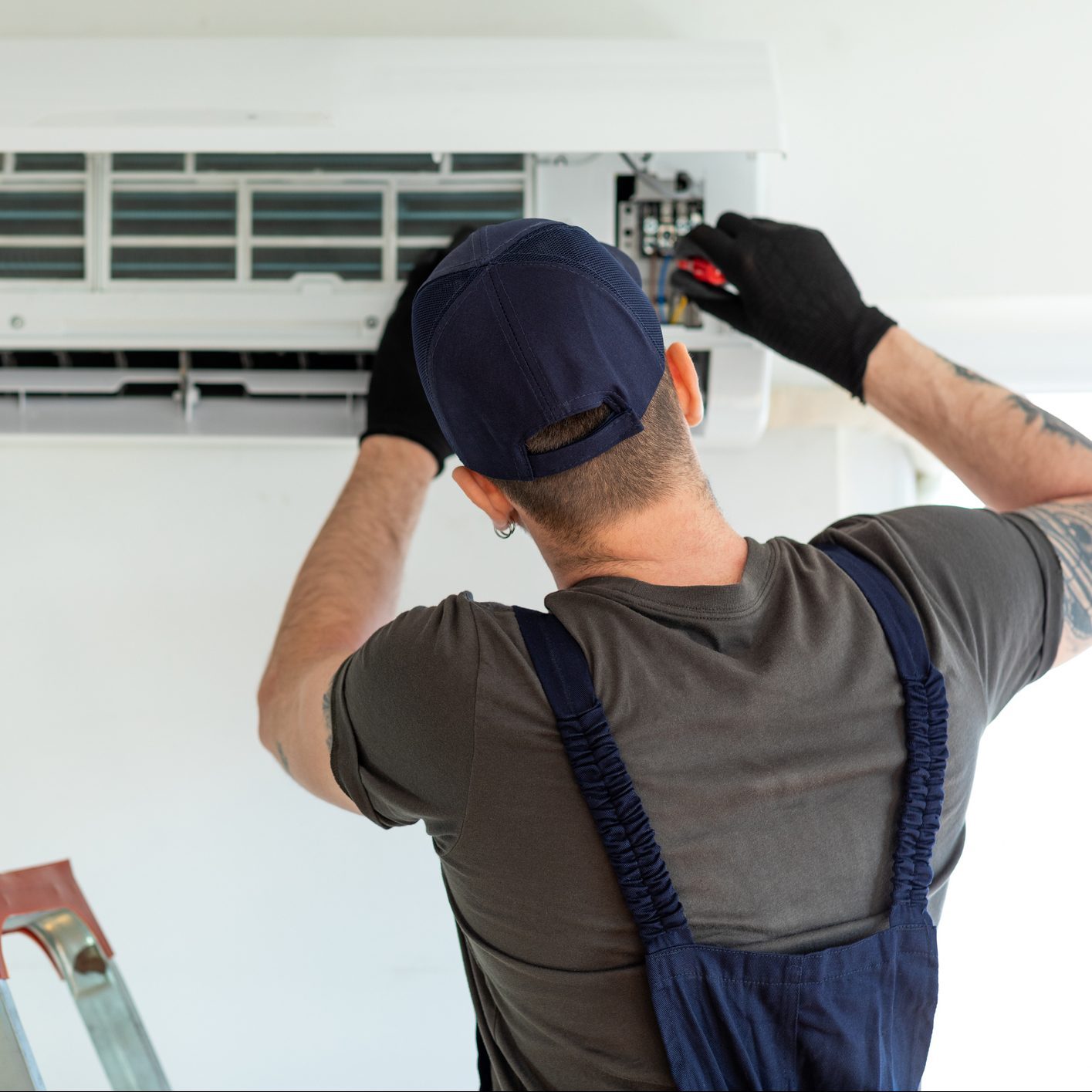 Technician repairing air conditioner