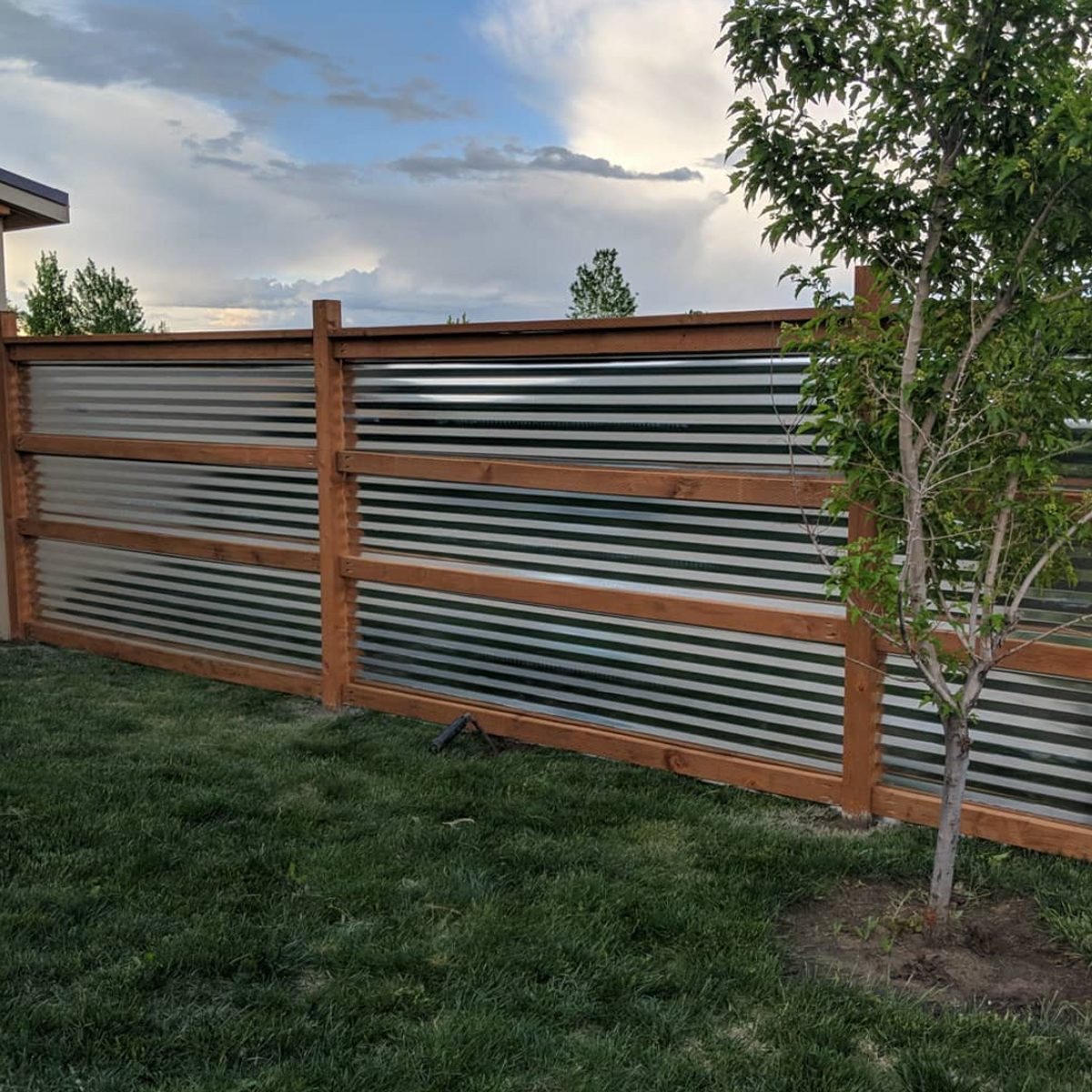 21 Fence on Slope Ideas for Your Backyard in 2023