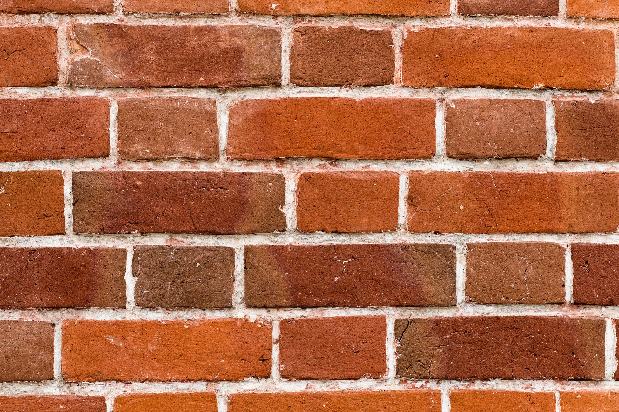 Red or brown wall. Facade of the building with new plaster. Abstract banner. Brickwork. Background. Texture.