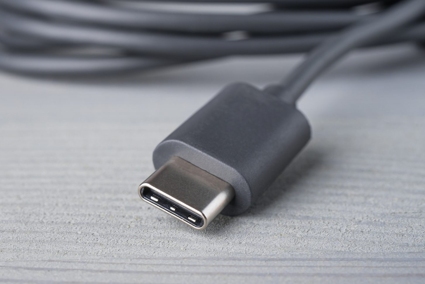 USB Type C connector with a grey cable.