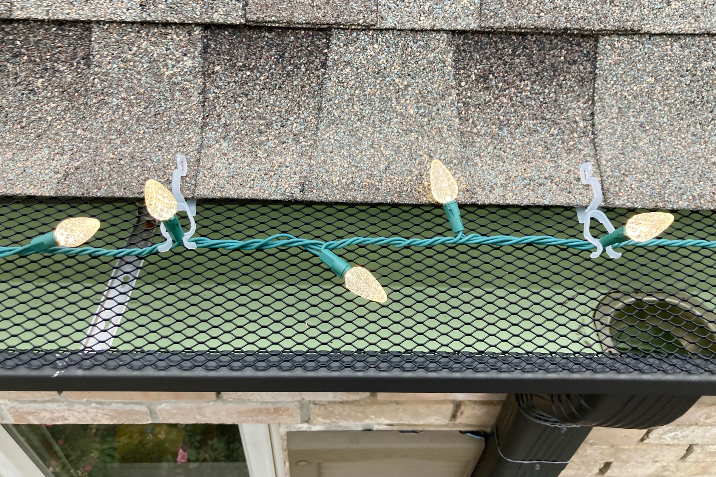 christmas lights clipped to a roof