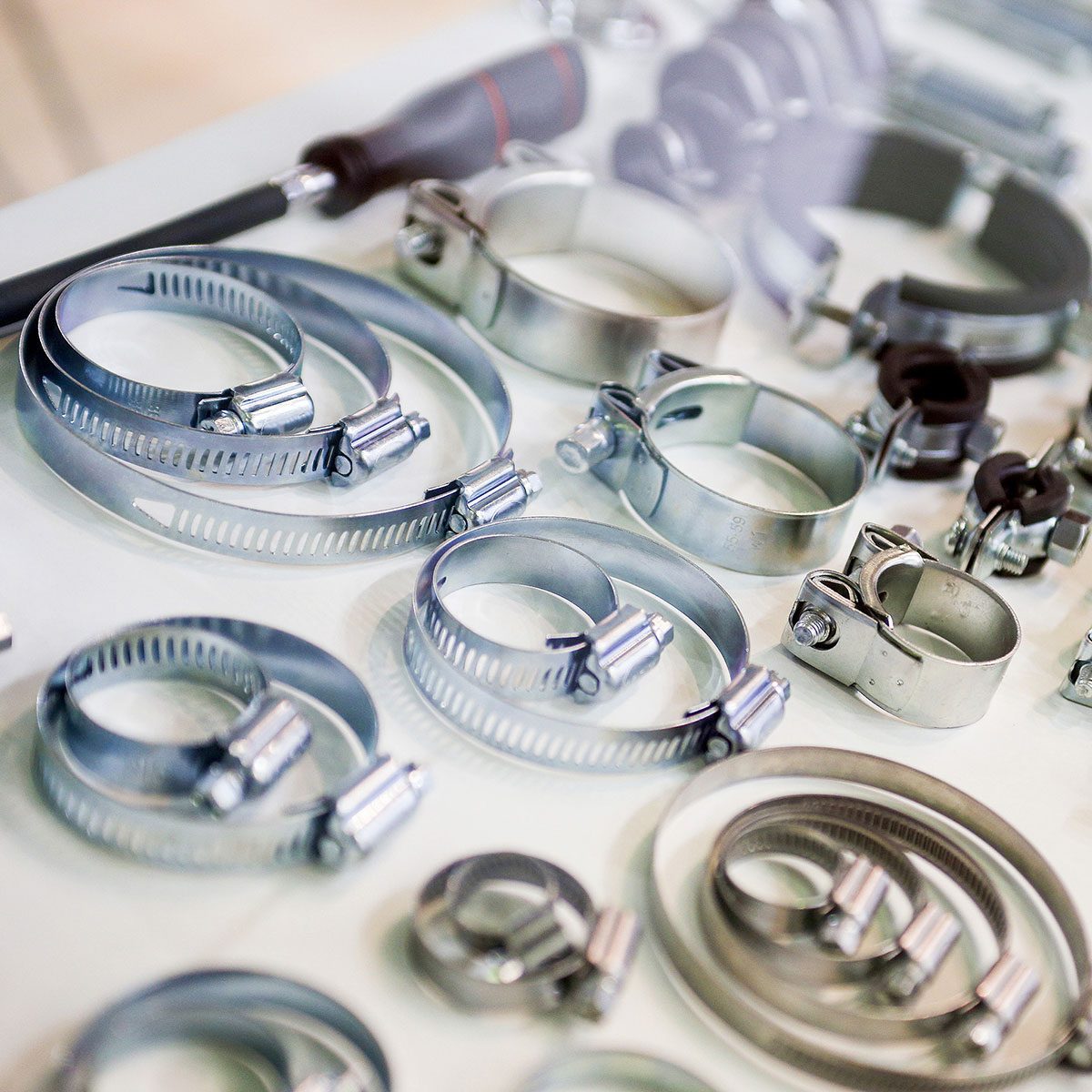 Stainless Steel Metal Hose Clamps on a work bench table