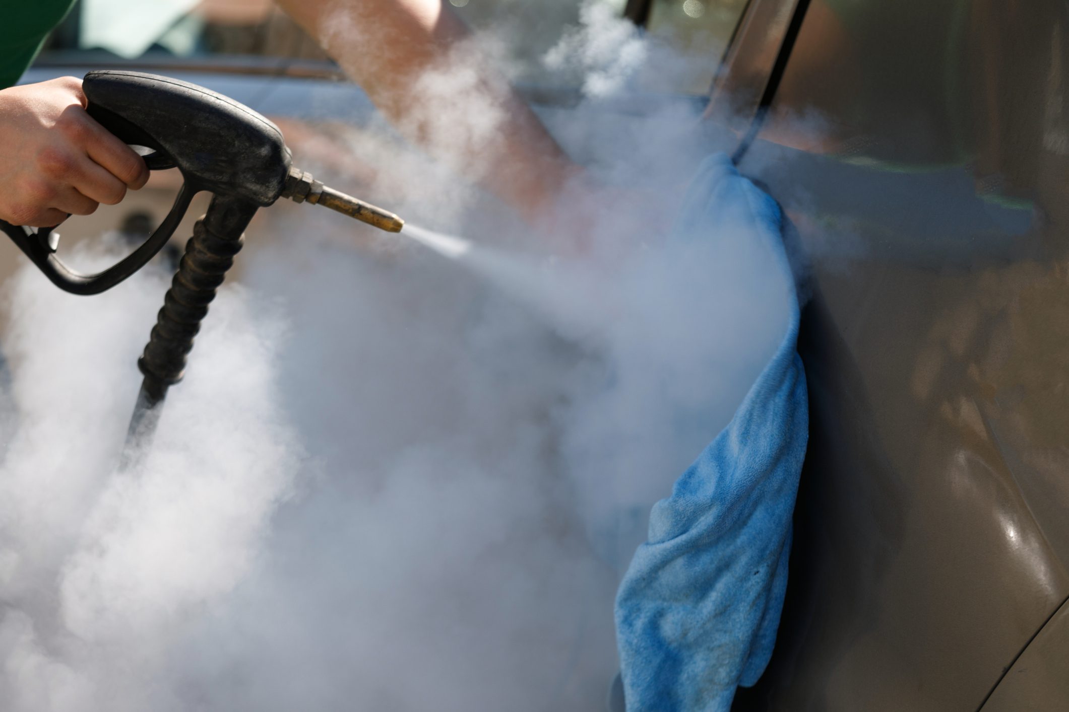 Car washing with a steam cleaner