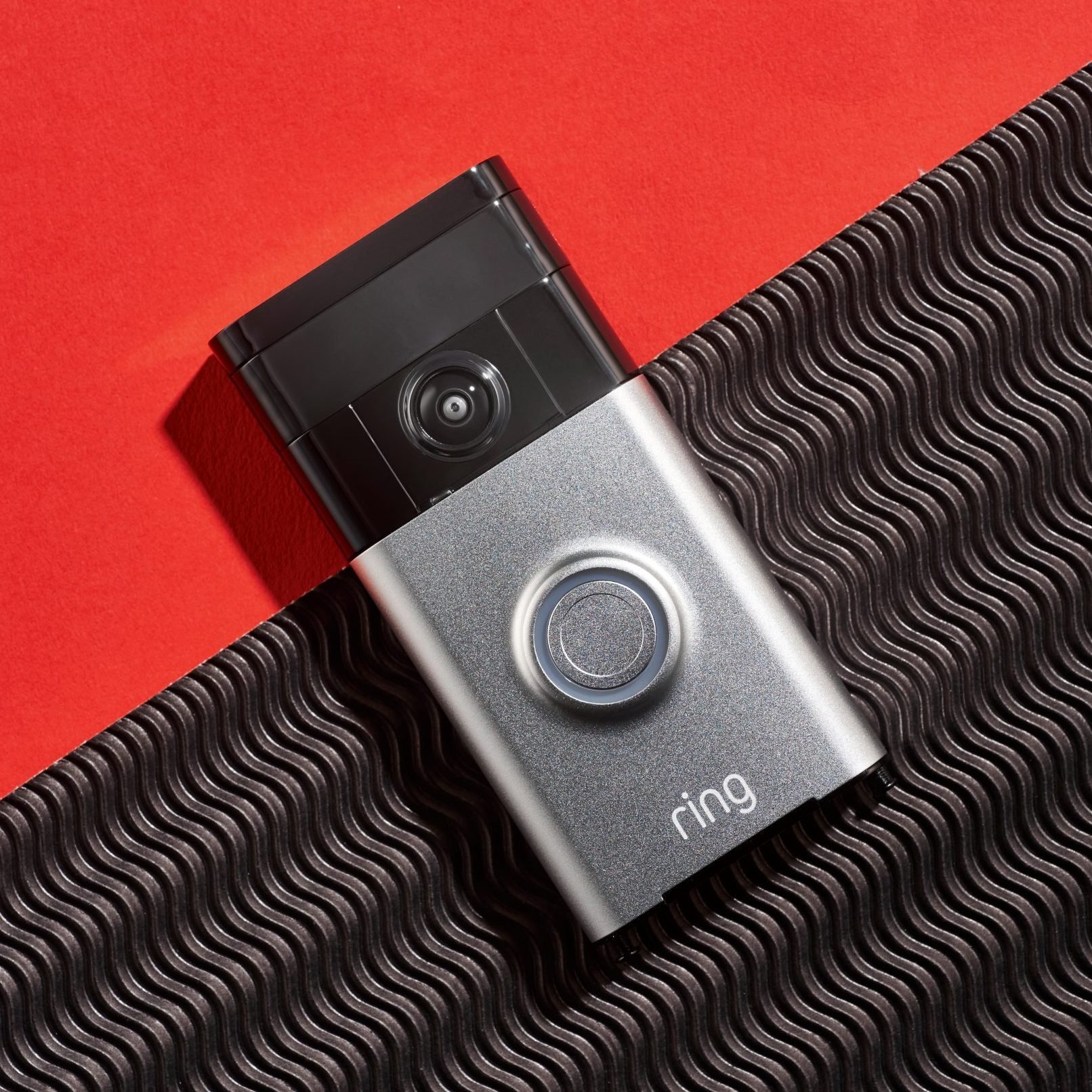 ring doorbell on a red background