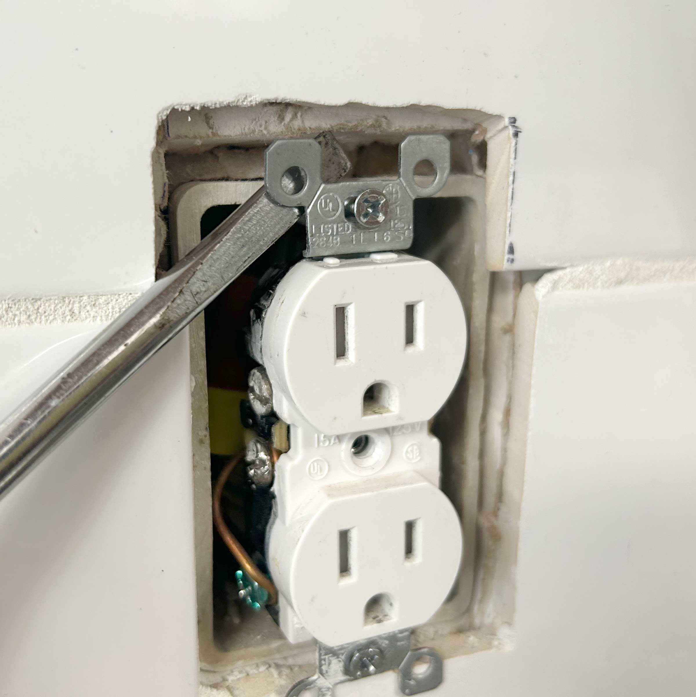 What are you using to get outlet power boxes to permanently stick