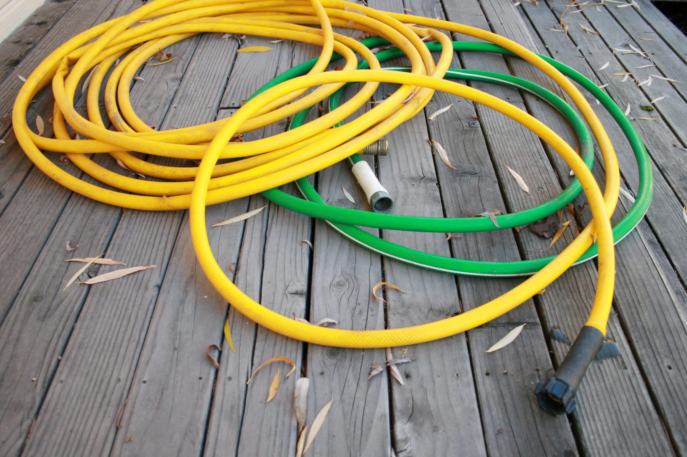 Green and yellow garden hoses