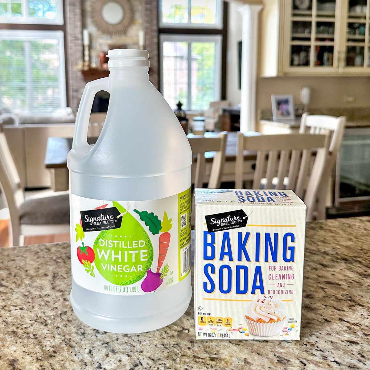 Diy Stovetop Cleaner, distilled vinegar bottle and Baking soda on Kitchen Countertop