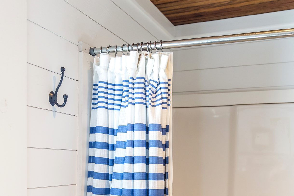 Small and compact bathroom shower stall in a small farmhouse decor