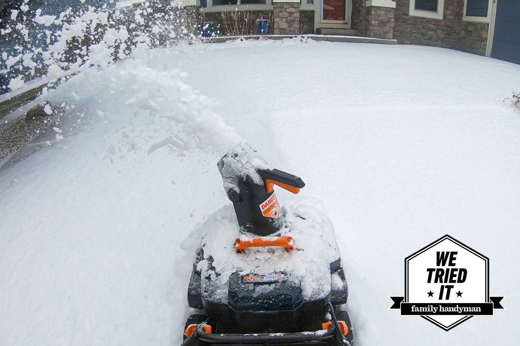 Snow blower blowing out fresh snow