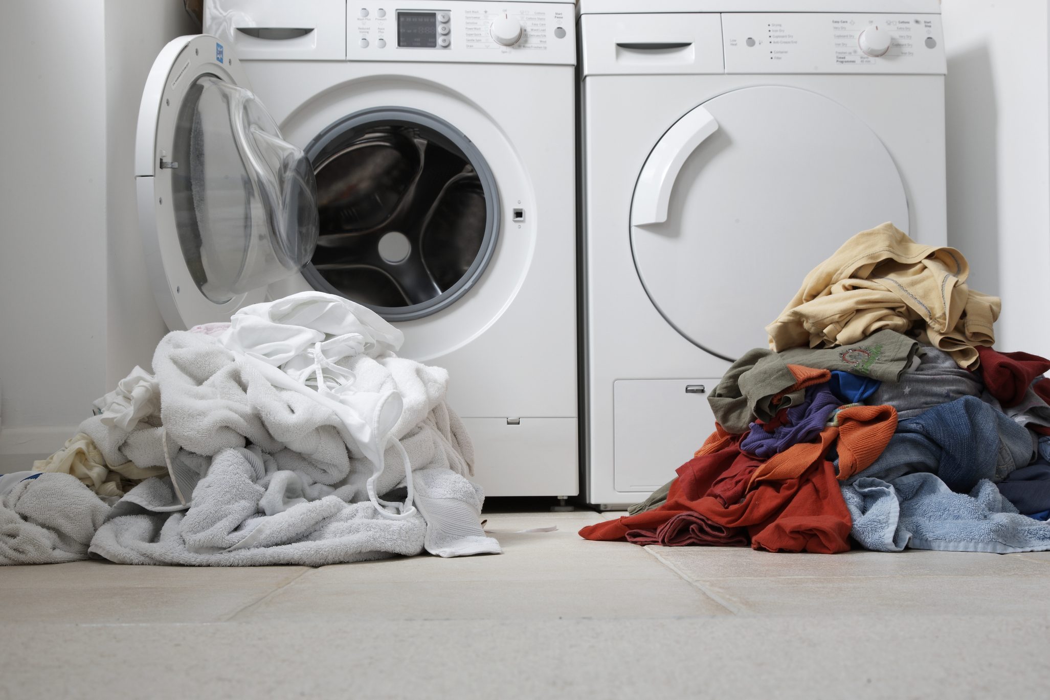 one coloured one white pile of washing