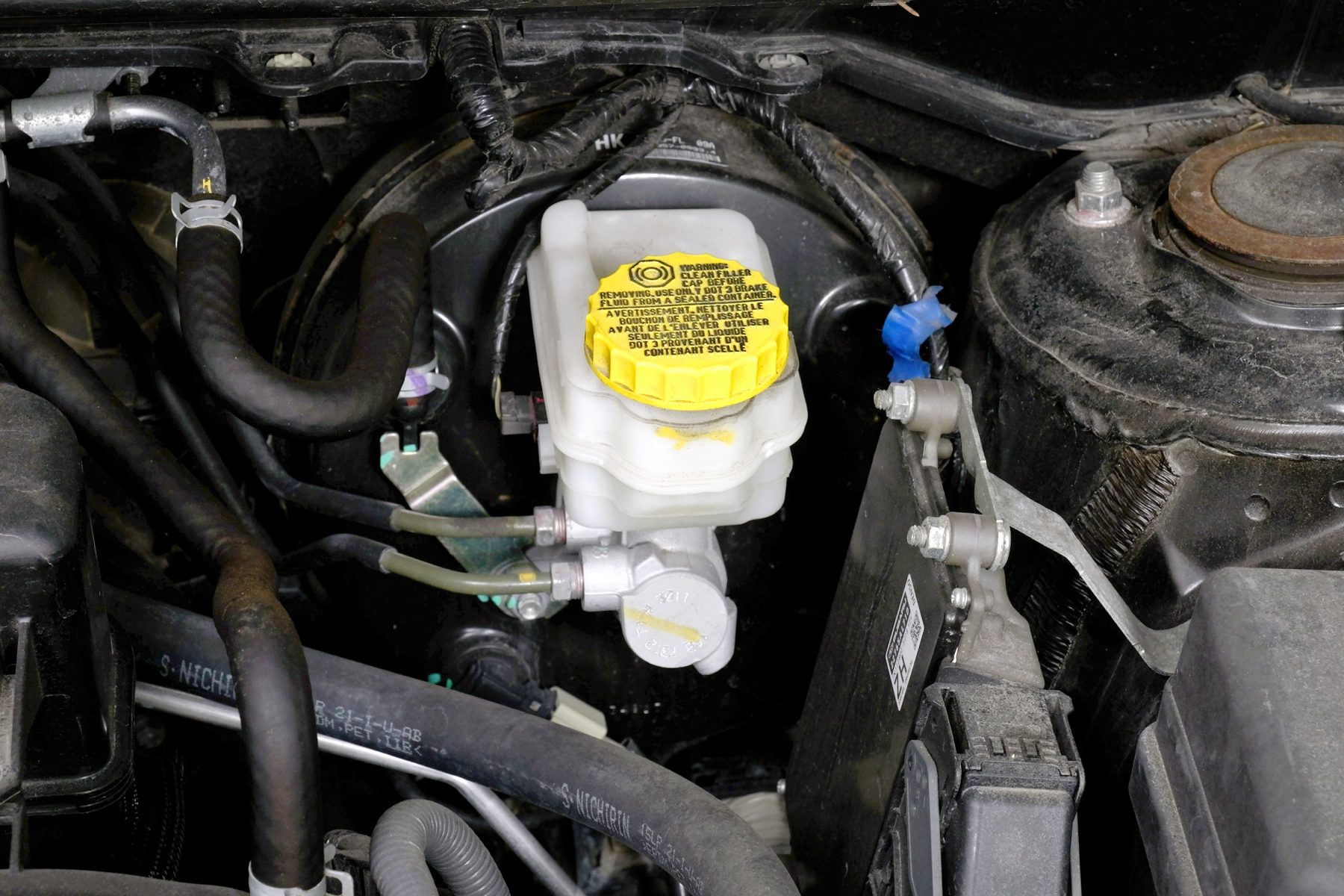 Open The Hood And Identify The Brake Fluid Reservoir