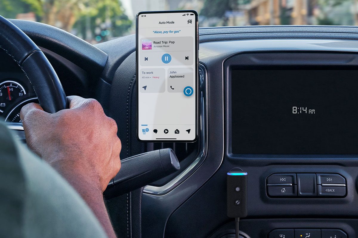 anonymous driver with Echo Auto 2nd Gen in a car with app running on phone