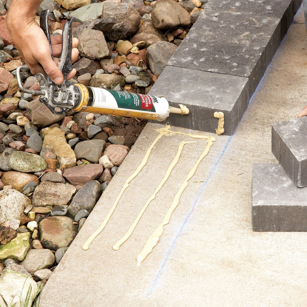 Glueing down bricks on concrete ground