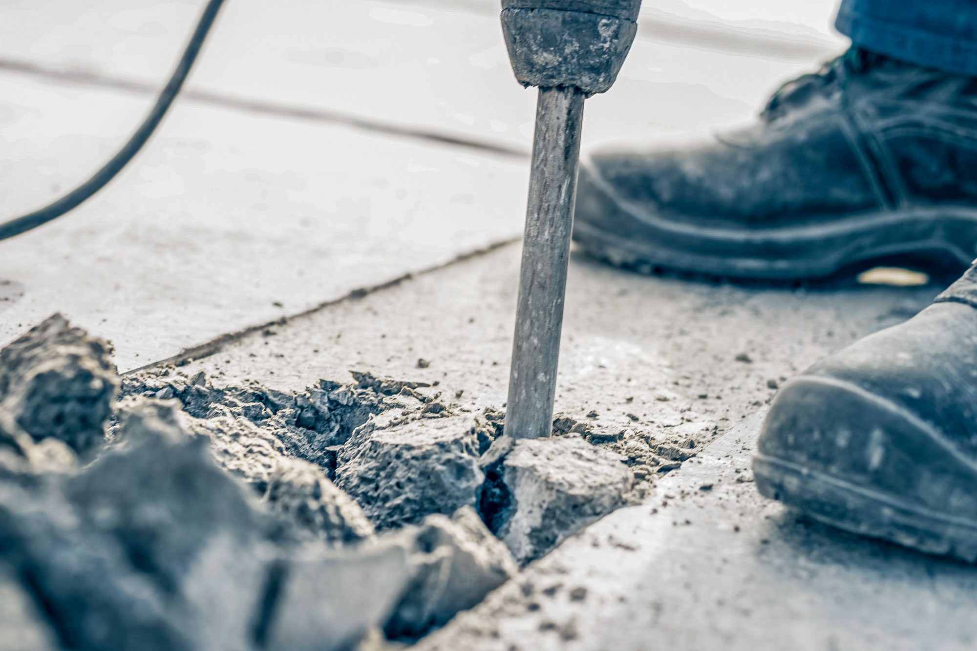 Construction Worker Operating Jackhammer