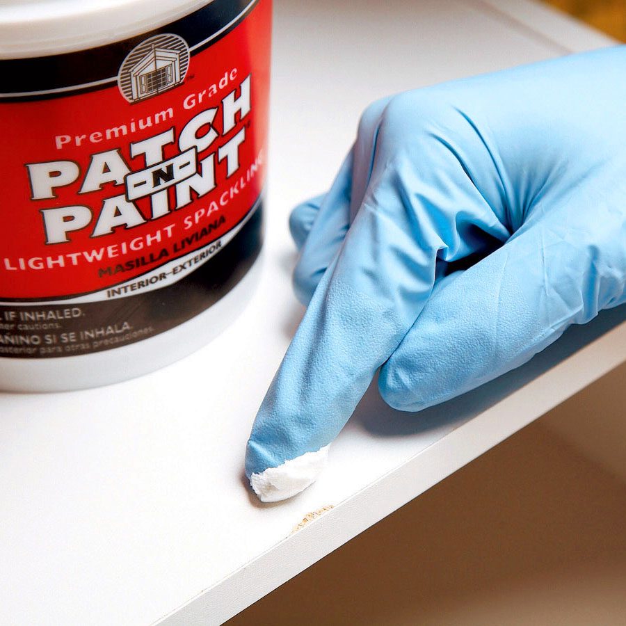 using putty to fix chips and scratches in the closet