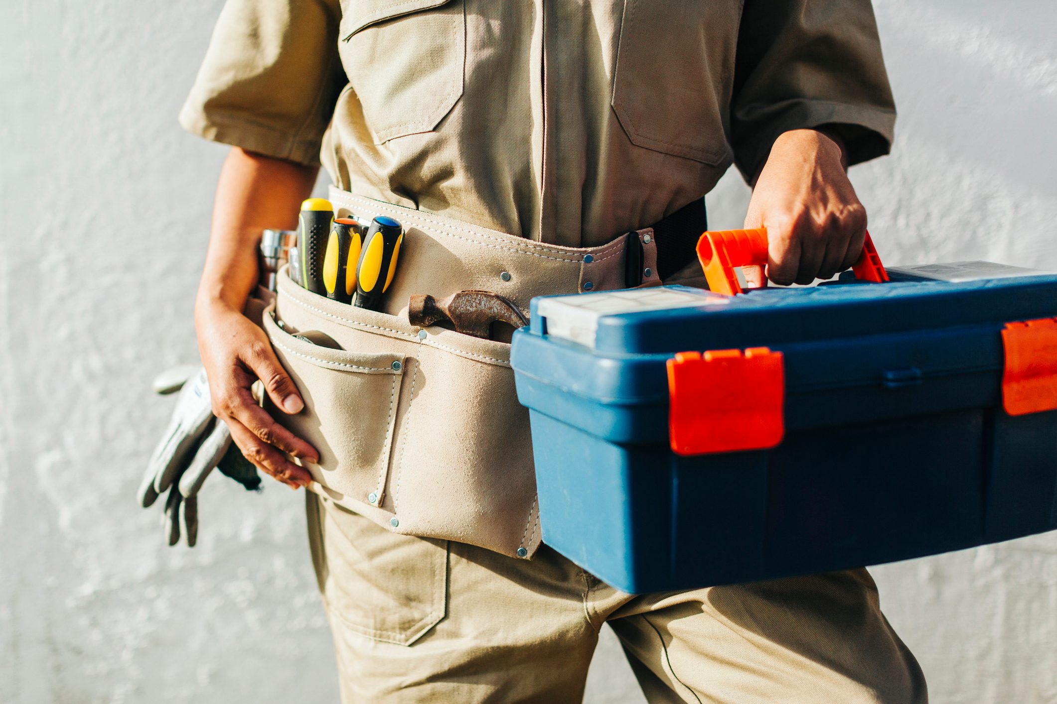 Close-up of a repair woman with tools