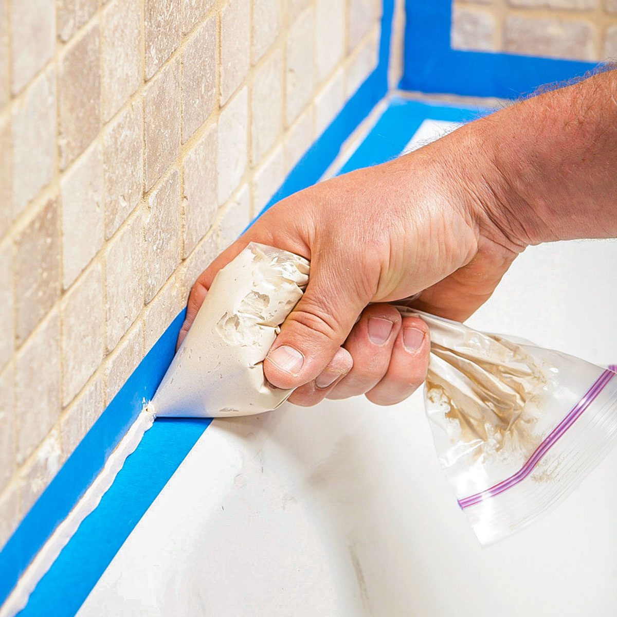 Applying Caulk Mixture on Wall