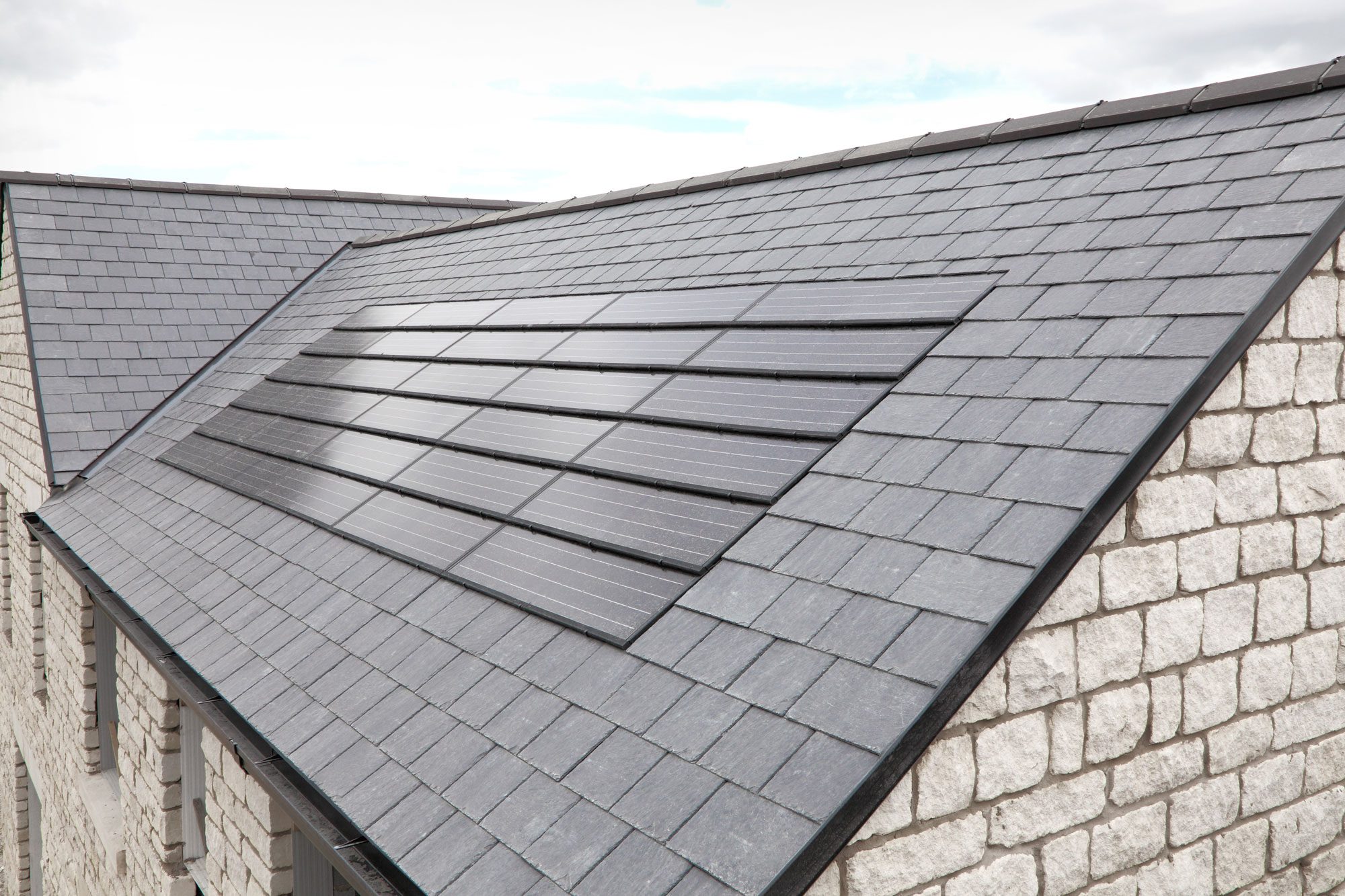 Solar Panels Installed On Black Tiled Roof