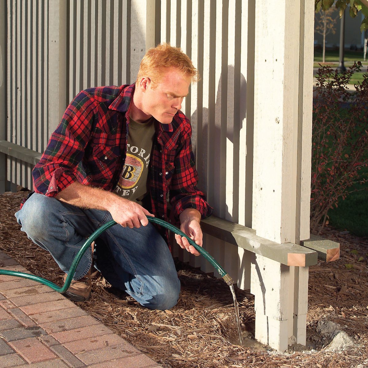 How To Build A Privacy Screen On Your Patio Fill the Dry Concrete Holes with Water