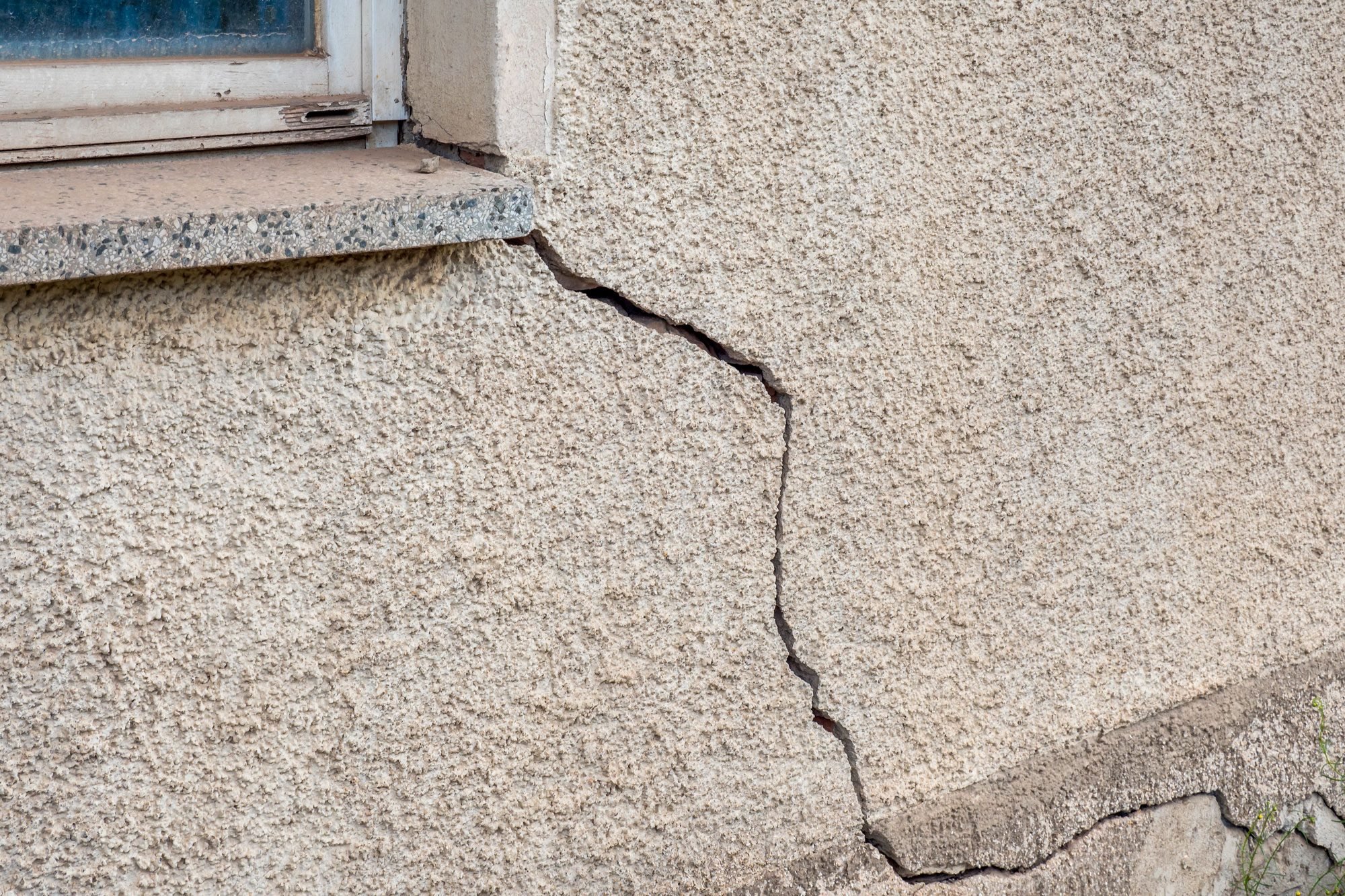 Large Crack In A Stucco Wall