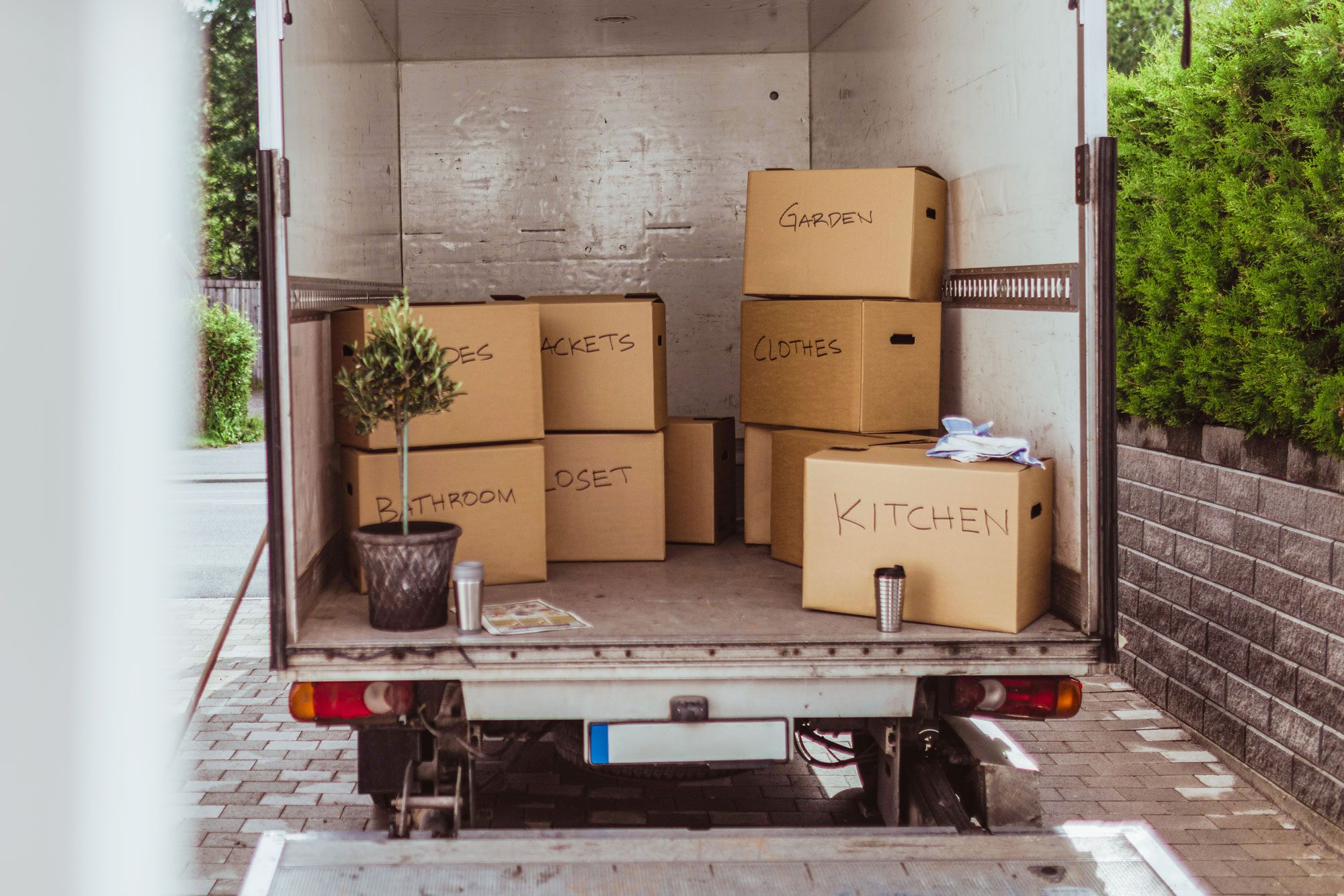 Cardboard Boxes Arranged In Back Of Moving Truck