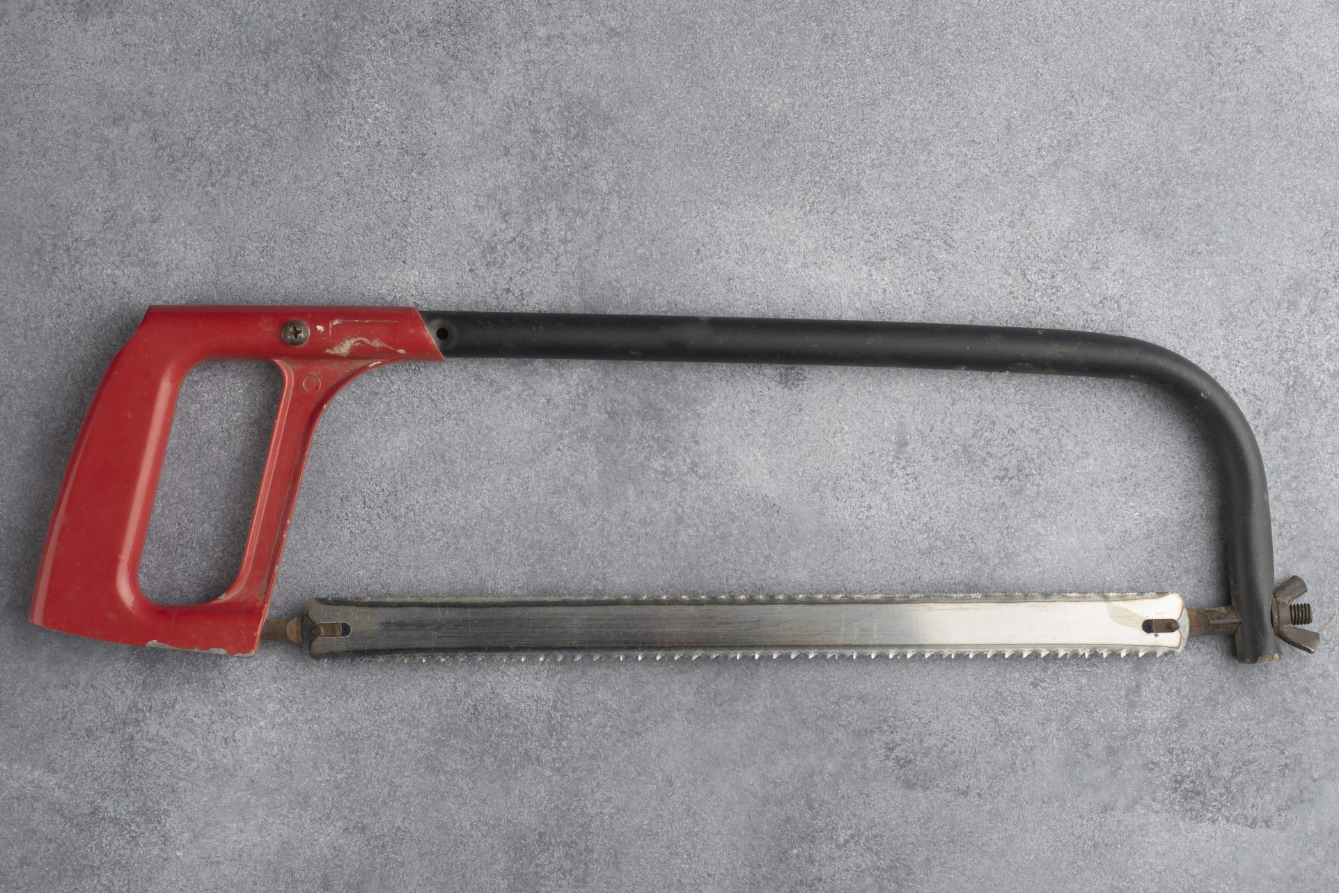 Hacksaw on a gray background