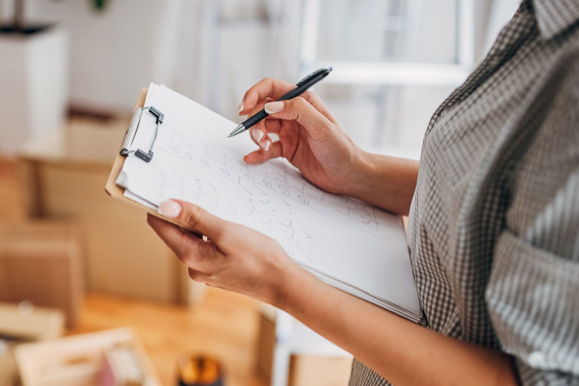 Woman Writing In Checklist