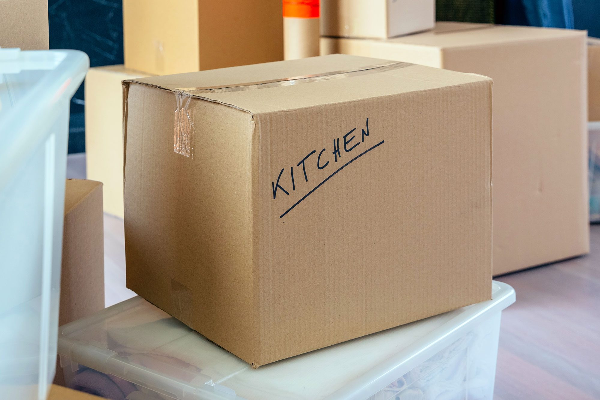 Moving Box With Kitchen Written On It