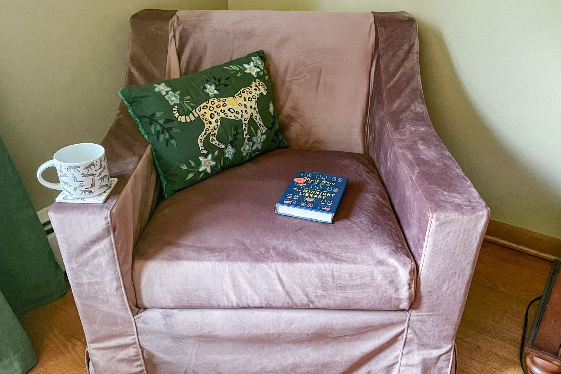 Book, cushion and mug on Evergreen Sabai Chair 